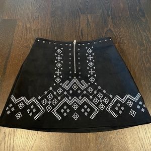 Black faux suede mini skirt with white designs